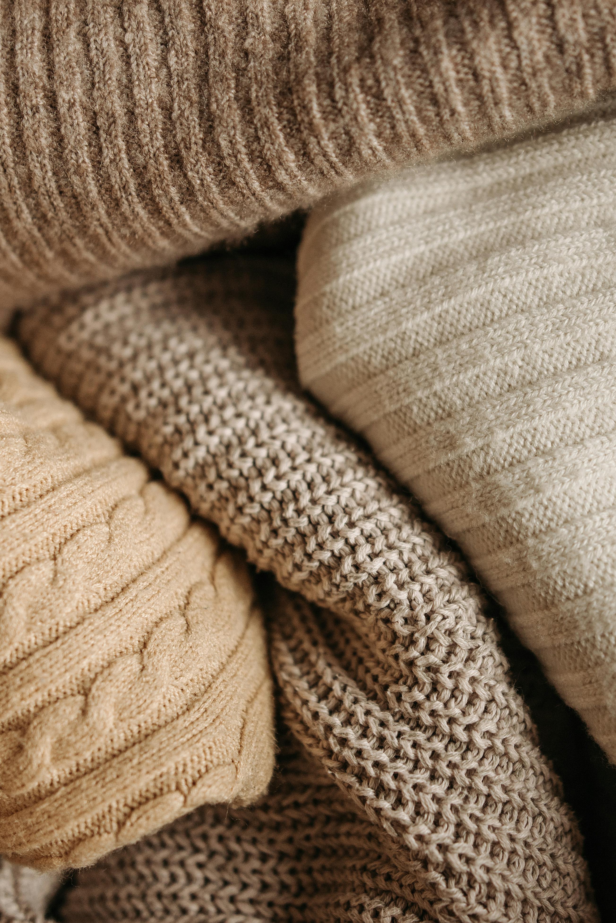 Close-up of a soft, vibrant red and blue knit textile, representing
